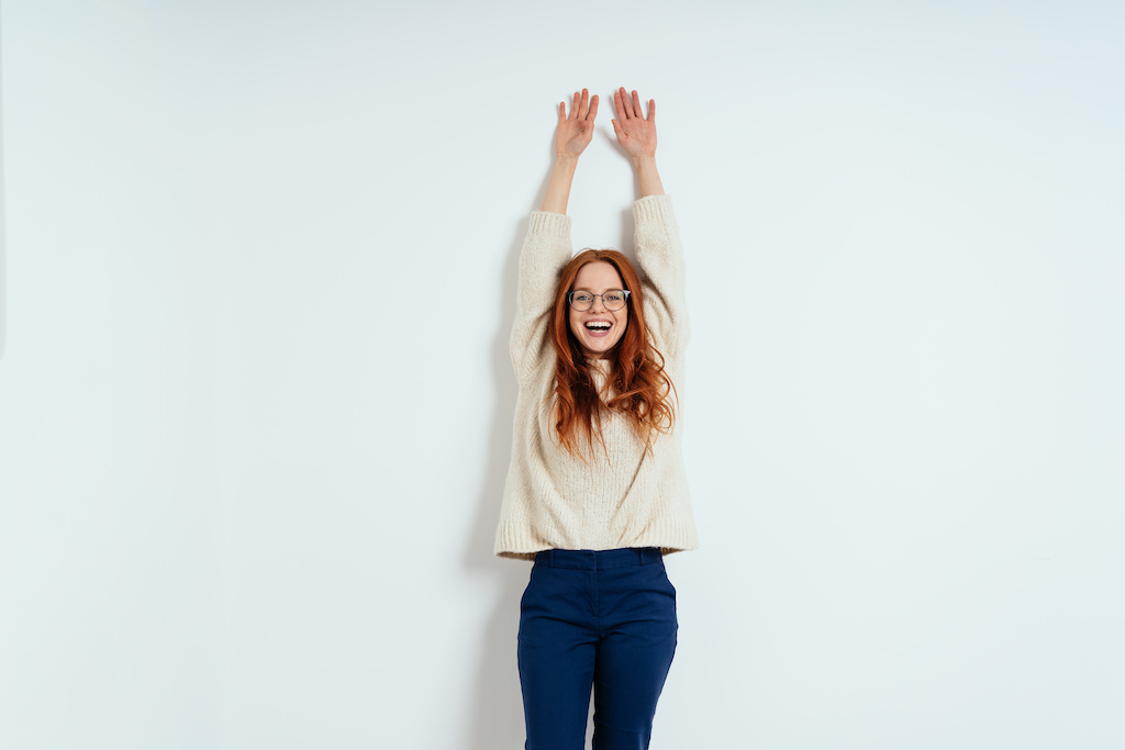 woman relief neck pain help tension stretch vertebrae relax spine stand up from desk happy energy